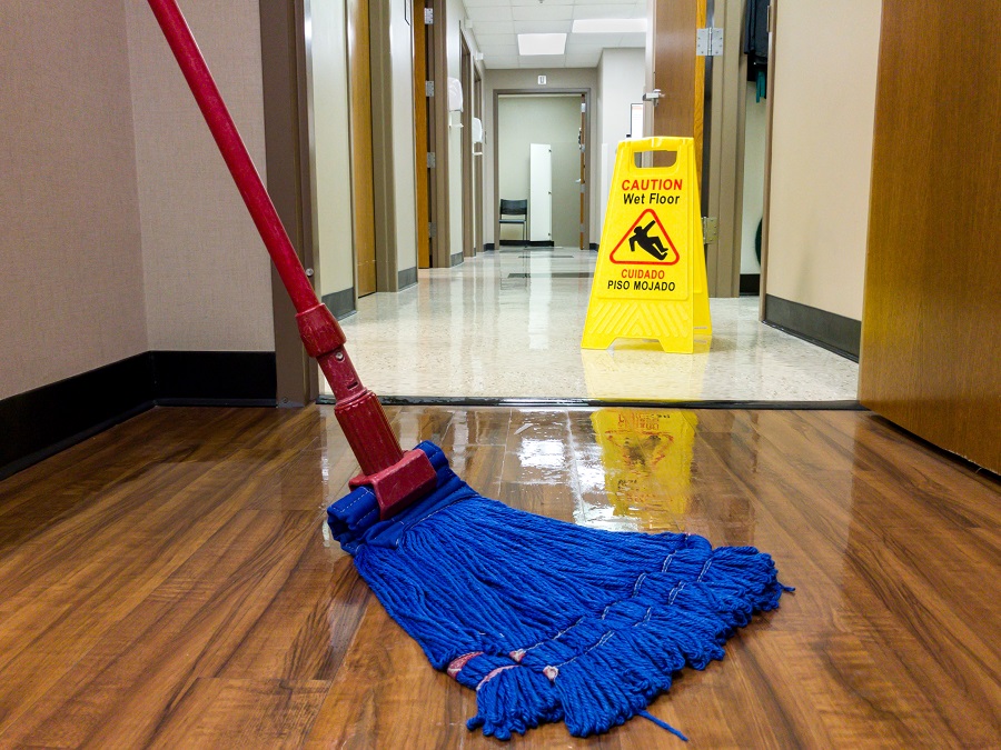 Wet floor with wet floor warning sign for safety is common at most Janitorial Service Companies. 